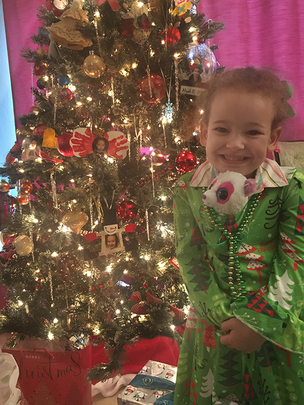 Aliyah Rose smiles at you in her Christmas dress